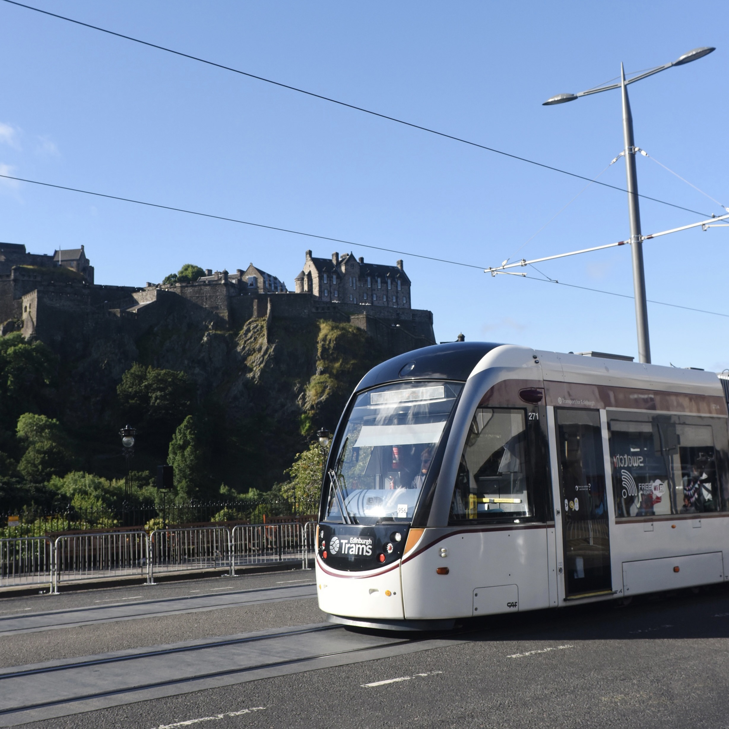 Tram passing Edinburgh Castle on Princes Street