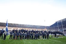 Scotland team with the Child Mascots on game day at Murrayfield Stadium