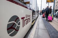 an image of a tram at a tram stop