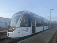 Tram with 'Rudolph', red nose, and antler stickers on it for Christmas