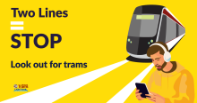 Two Lines = Stop. Look out for trams campaign with bright yellow background and a person with headphones on listening to their phone as a tram approaches