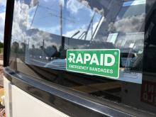 An image of the RAPAID logo on a green sticker in the window of a tram cab.