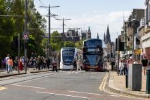 An image of a bus and tram on Princes Street