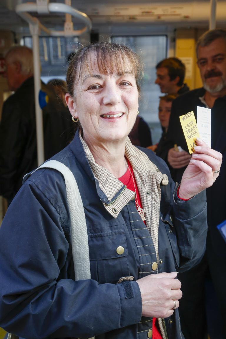 Woman holding ticket