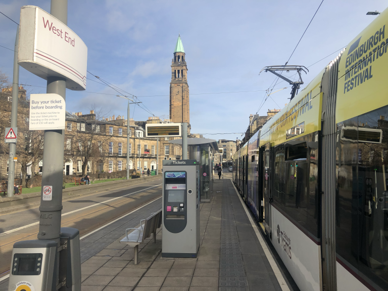 West End tram stop with tram sitting at the stop