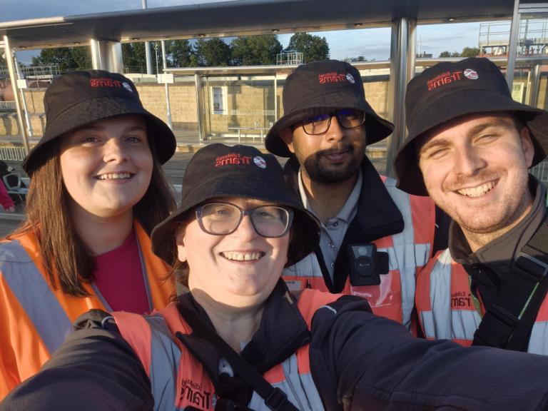 tram staff wearing bucket hats