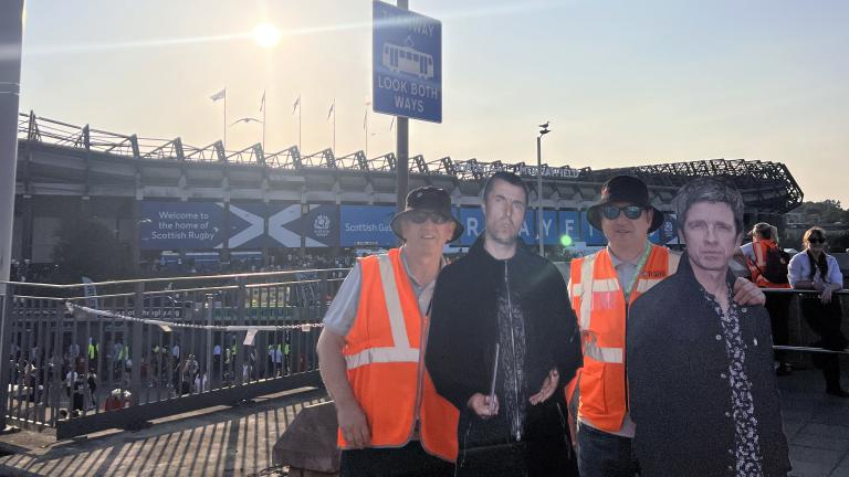 Tram staff with Oasis cardboard cutouts