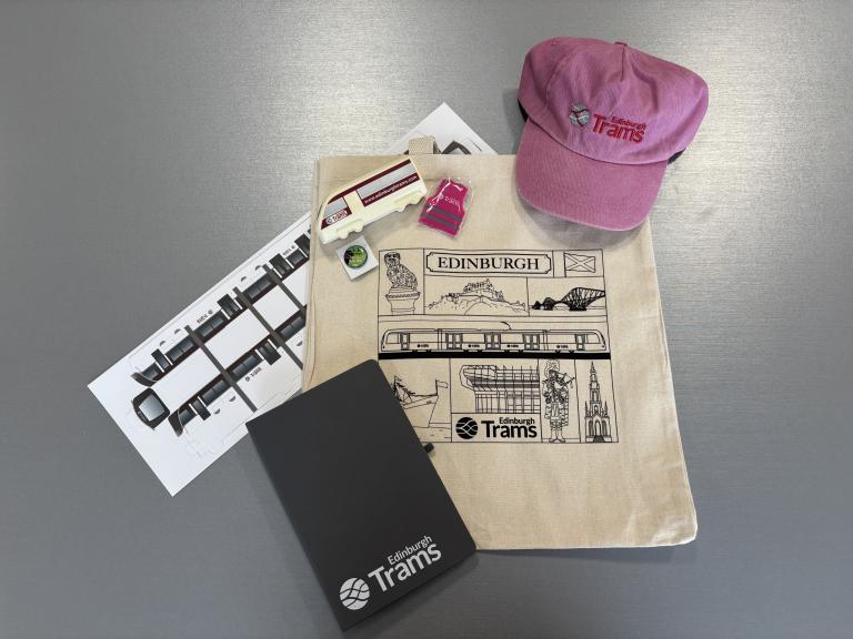 Edinburgh Trams merch - tote bag, cap, paper tram, notebook, squashy tram, hi-vis keyring, badge
