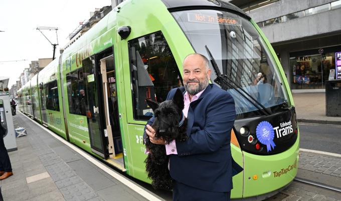 Managing Director Lea Harrison with the tram and Toto the dog