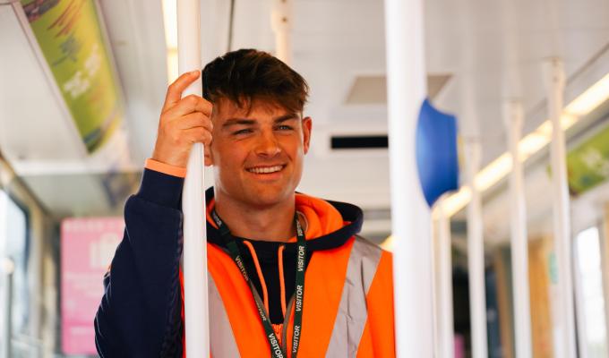 An image of player Ross Thompson on a tram