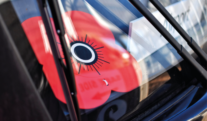 Edinburgh Trams window with a poppy 