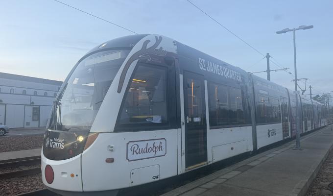 Tram with 'Rudolph', red nose, and antler stickers on it for Christmas